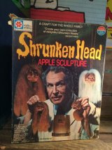 SHRUNKEN HEAD APPLE SCULPTRE 