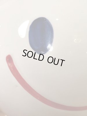 スマイルの陶器製の70年代ビンテージ貯金箱