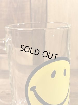 スマイルフェイスが描かれたガラス製の70’sヴィンテージジョッキグラス