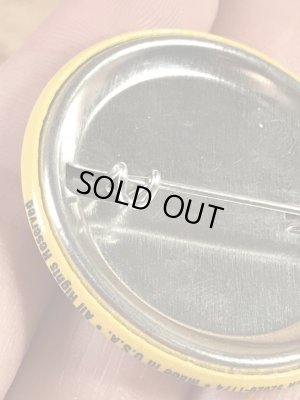 “The One With The Most Buttons Wins”と書かれたスマイルフェイスの80’sヴィンテージ缶バッチ