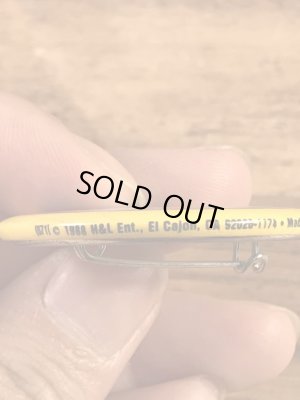 “The One With The Most Buttons Wins”と書かれたスマイルの80年代ビンテージ缶バッジ