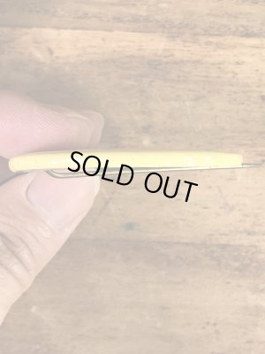 スマイルフェイスのブリキ製の70’sヴィンテージ缶バッチ