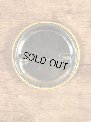 “The One With The Most Buttons Wins”と書かれたスマイルフェイスの80’sヴィンテージ缶バッチ