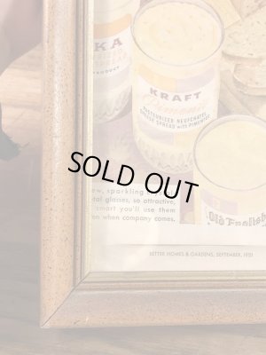 ガラスの額縁にクラフトチーズの広告が入った50年代ビンテージ壁掛け