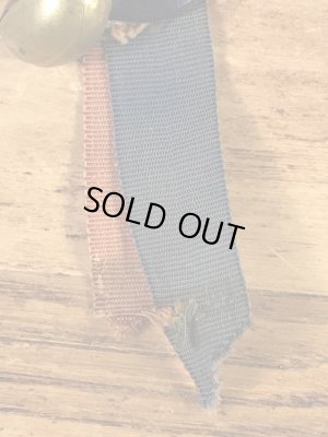 カレッジ物のフットボール大会の40’sヴィンテージ缶バッチ