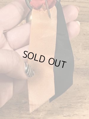 ユニバーシティ物のフットボールイベントの40’sヴィンテージ缶バッチ