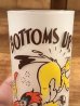 “Bottoms Up!”のメッセージが書かれたキツツキのキャラクターの60年代ビンテージグラス