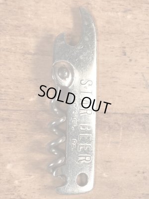 スタービールの折り畳みのコークスクリューが付いたビンテージ栓抜き