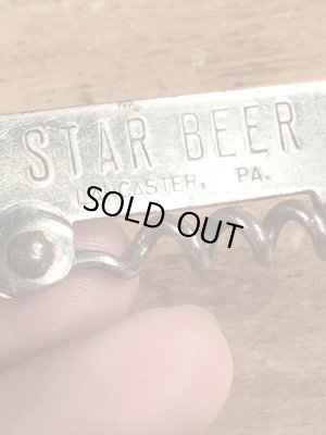 スタービールの折り畳みのコークスクリューが付いたビンテージ栓抜き