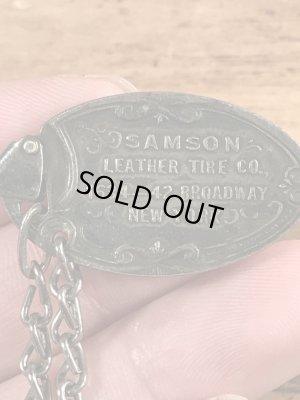 Samson Leather Tire Co.の企業物のビンテージノメタルタグ