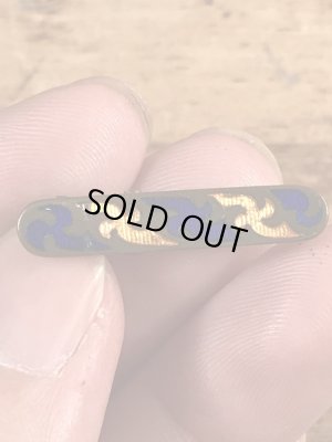 クロスの模様が描かれた真鍮製のビンテージクリップ