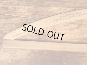 アメリカの企業物のアンティークのウッドハンガー