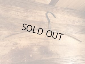 アメリカの企業物のアンティークのウッドハンガー