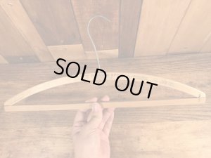 アメリカの企業物のアンティークのウッドハンガー