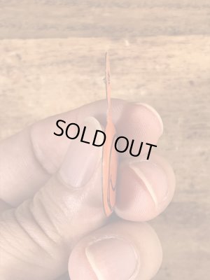 スマイルの顔が描かれたビンテージタブバッジ