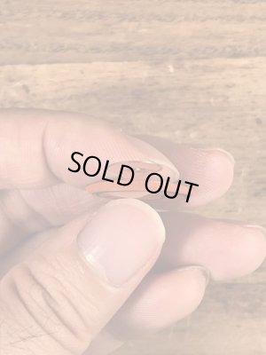 スマイルの顔が描かれたヴィンテージタブバッチ