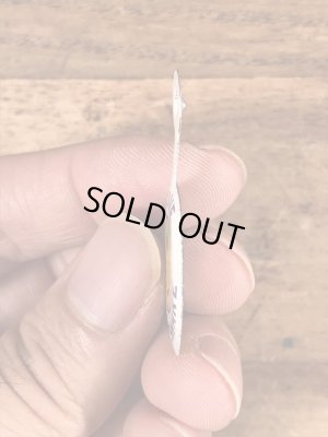 スマイルの顔が描かれたビンテージタブバッジ