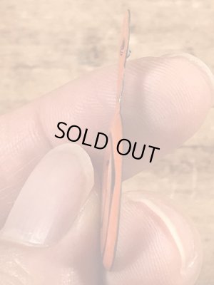 スマイルの顔が描かれたビンテージタブバッジ