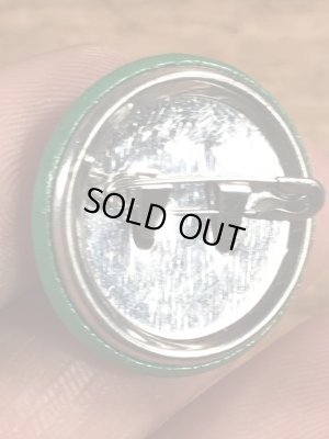 目がクローバーになったスマイルフェイスのヴィンテージ缶バッチ