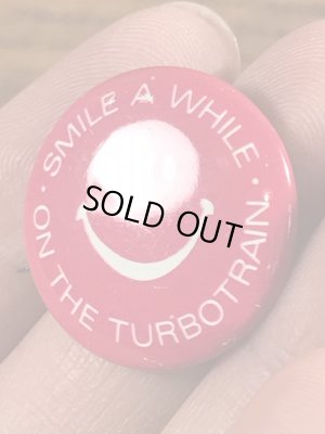 スマイルフェイスの企業物のヴィンテージ缶バッチ