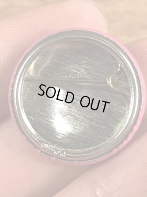 目が$マークになったスマイルフェイスのヴィンテージ缶バッチ