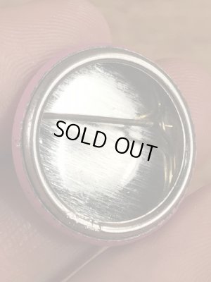 目が$マークになったスマイルフェイスのヴィンテージ缶バッチ