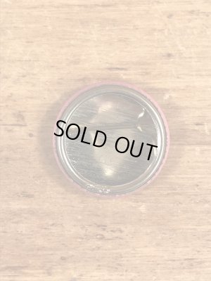 目が$マークになったスマイルフェイスのヴィンテージ缶バッチ