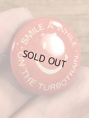 スマイルの顔とメッセージが書かれたビンテージ缶バッジ