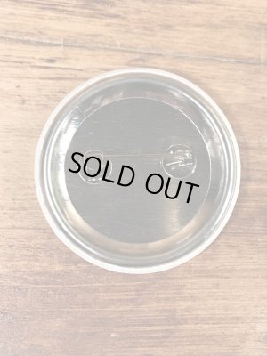 目がクローバーになったスマイルフェイスのヴィンテージ缶バッチ