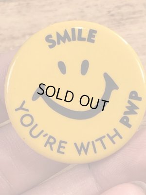 70年代頃の企業物のスマイルのビンテージの缶バッジ