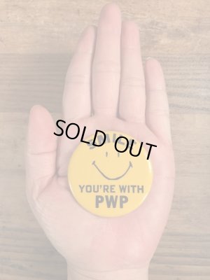 70年代頃の企業物のスマイルフェイスのビンテージの缶バッジ