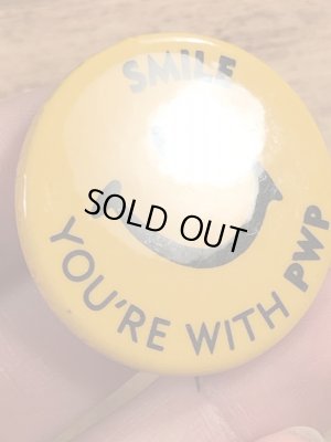 70年代頃の企業物のスマイルのビンテージの缶バッジ