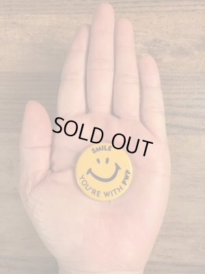 70年代頃の企業物のスマイルのビンテージの缶バッジ