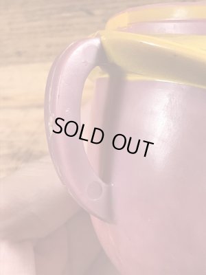 アドバタイジングキャラクターのファニーフェイスのビンテージのマグカップ