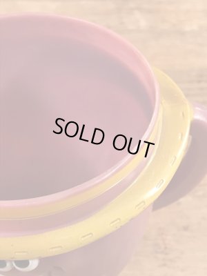 アドバタイジングキャラクターのファニーフェイスのビンテージのマグカップ