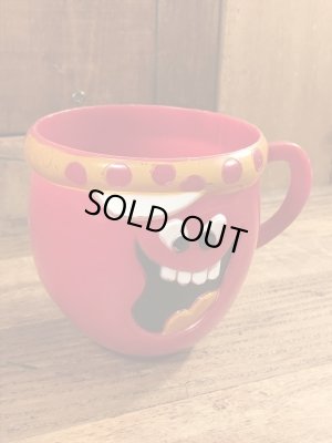 アドバタイジングキャラクターのファニーフェイスのビンテージのマグカップ