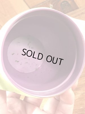 ファニーフェイスのグーフィーグレープのビンテージのマグカップ