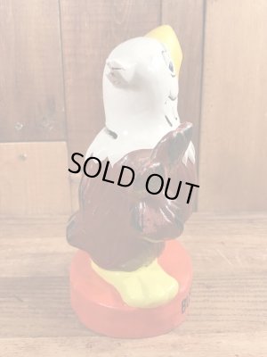 ブッシュガーデンのアドバタイジングキャラクターのビンテージのコインバンクドール