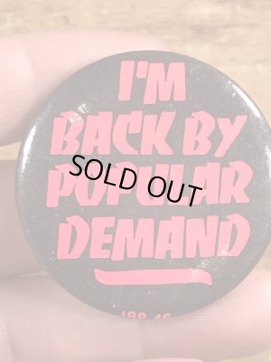 80年代頃のI'm Back By Popular Demandのメッセージが書かれたビンテージの缶バッジ