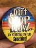 80年代頃のDon't Stop Now...のメッセージが書かれたビンテージの缶バッジ