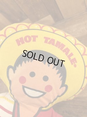 企業キャラクターのホットタマレキッドのぬいぐるみ