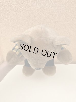 ギンガムチェックの服を着たビンテージのテディベア