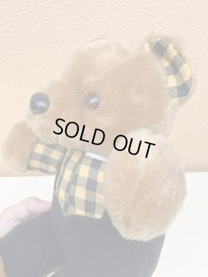 ギンガムチェックの服を着たビンテージのテディベア