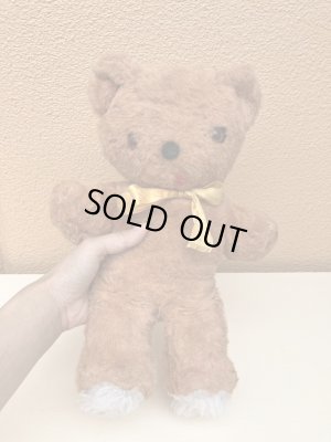 リボンの付いたビンテージのオールドテディベアのぬいぐるみ