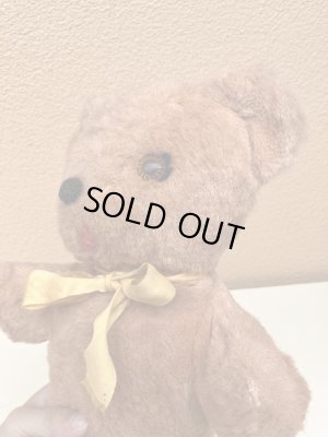 リボンの付いたビンテージのオールドテディベアのぬいぐるみ