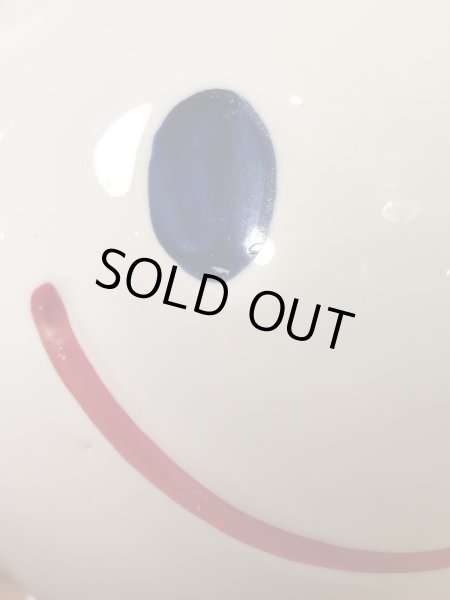 スマイルの陶器製の70年代ビンテージ貯金箱