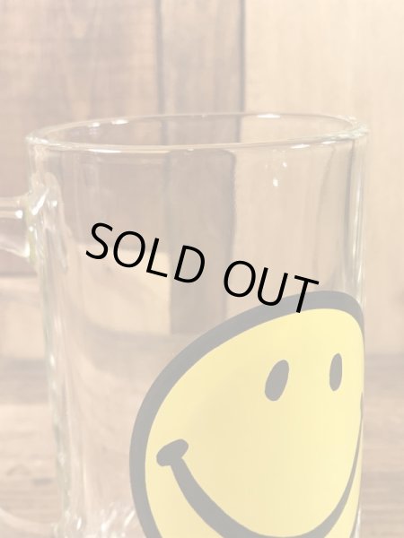 スマイルフェイスが描かれたガラス製の70’sヴィンテージジョッキグラス