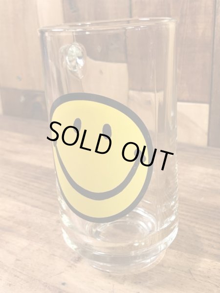 スマイルフェイスが描かれたガラス製の70’sヴィンテージジョッキグラス