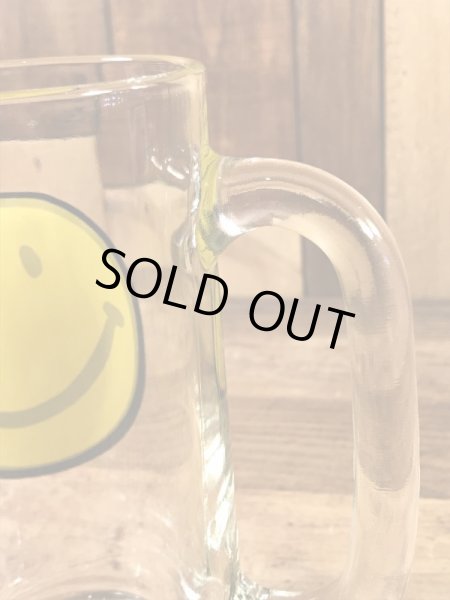 スマイルフェイスが描かれたガラス製の70’sヴィンテージジョッキグラス