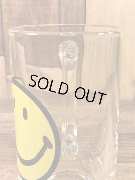 スマイルフェイスが描かれたガラス製の70’sヴィンテージジョッキグラス